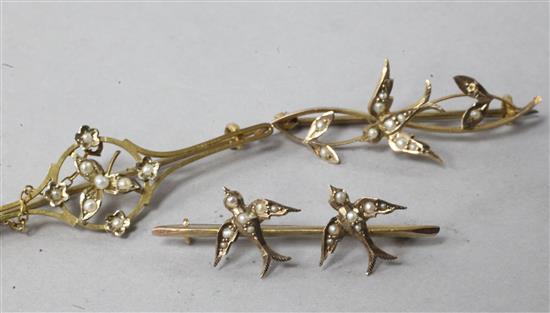 Three Edwardian 9ct gold and seed pearl brooches including two swallow brooches.